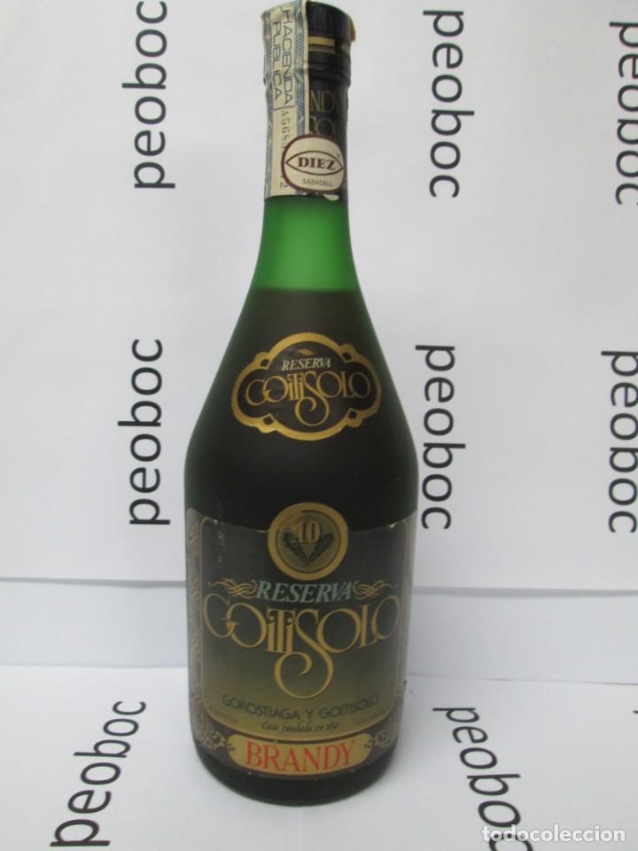 Coleccionismo de vinos y licores: ANTIGUA BOTELLA BRANDY CO&Ntilde;AC, GOITISOLO RESERVA, IMPUESTO DE 8 PTS, DECADA 70-80