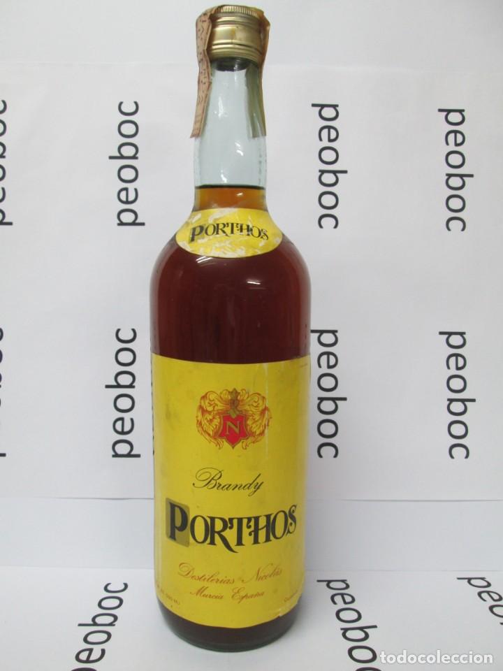 Coleccionismo de vinos y licores: ANTIGUA BOTELLA BRANDY CO&Ntilde;AC, PORTHOS, DE IMPUESTO DE 4 PTS, DECADA 60-70