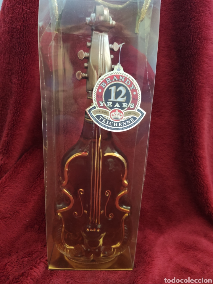 Coleccionismo de vinos y licores: Botella Brandy Teichenne viol&iacute;n