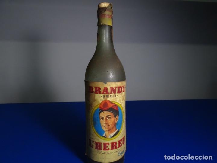 Coleccionismo de vinos y licores: BRANDY SECO L&rsquo;HEREU. COGUL. REUS. BOTELLA MEDIA SIN ABRIR. SELLO FRANCO.