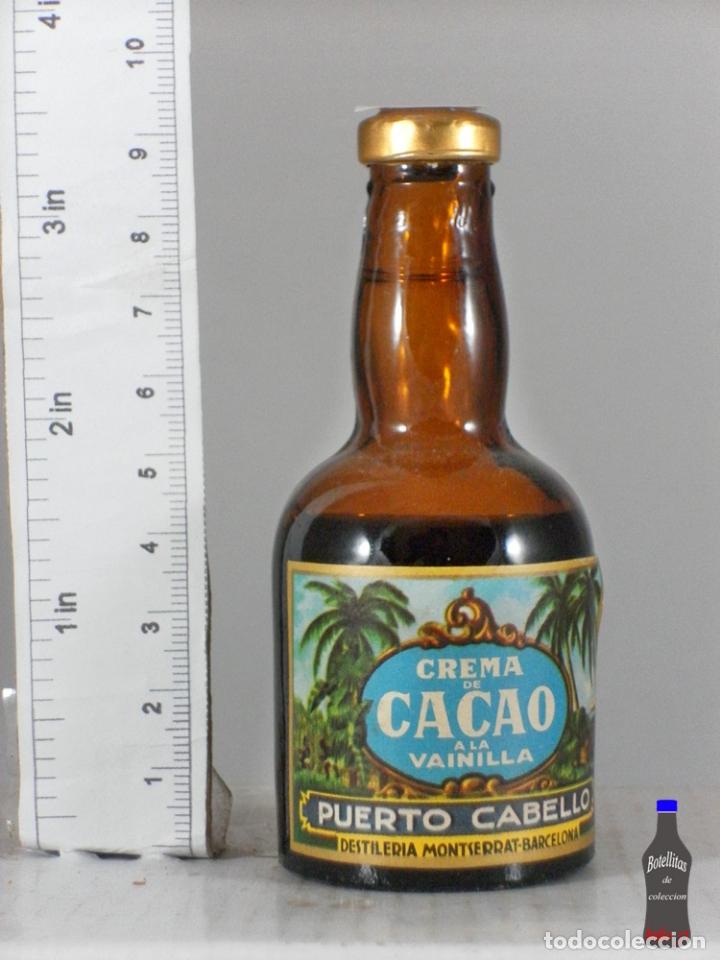 Sammlung von Weinen und Lik&ouml;ren: BOTELLITA BOTELLIN CREMA DE CACAO A LA VAINILLA PUERTO CABELLO MONTSERRAT BARCELONA