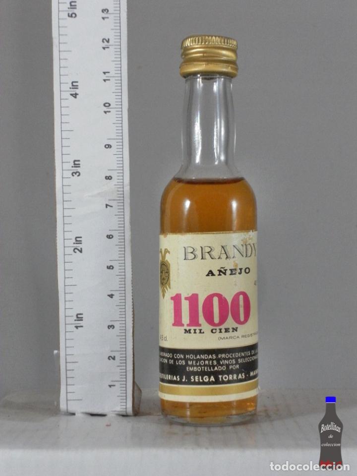 Coleccionismo de vinos y licores: BOTELLITA BOTELLIN BRANDY A&Ntilde;EJO 1100 MIL CIEN DESTILERIAS J. SELGA TORRAS