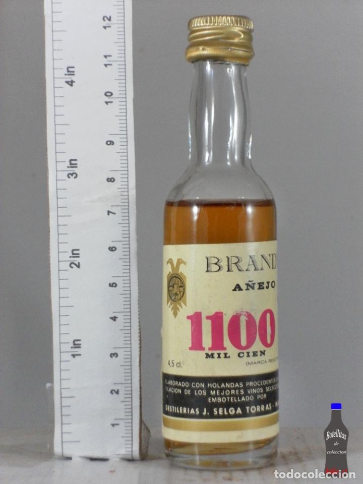 Coleccionismo de vinos y licores: BOTELLITA BOTELLIN BRANDY A&Ntilde;EJO 1100 MIL CIEN DESTILERIAS J. SELGA TORRAS