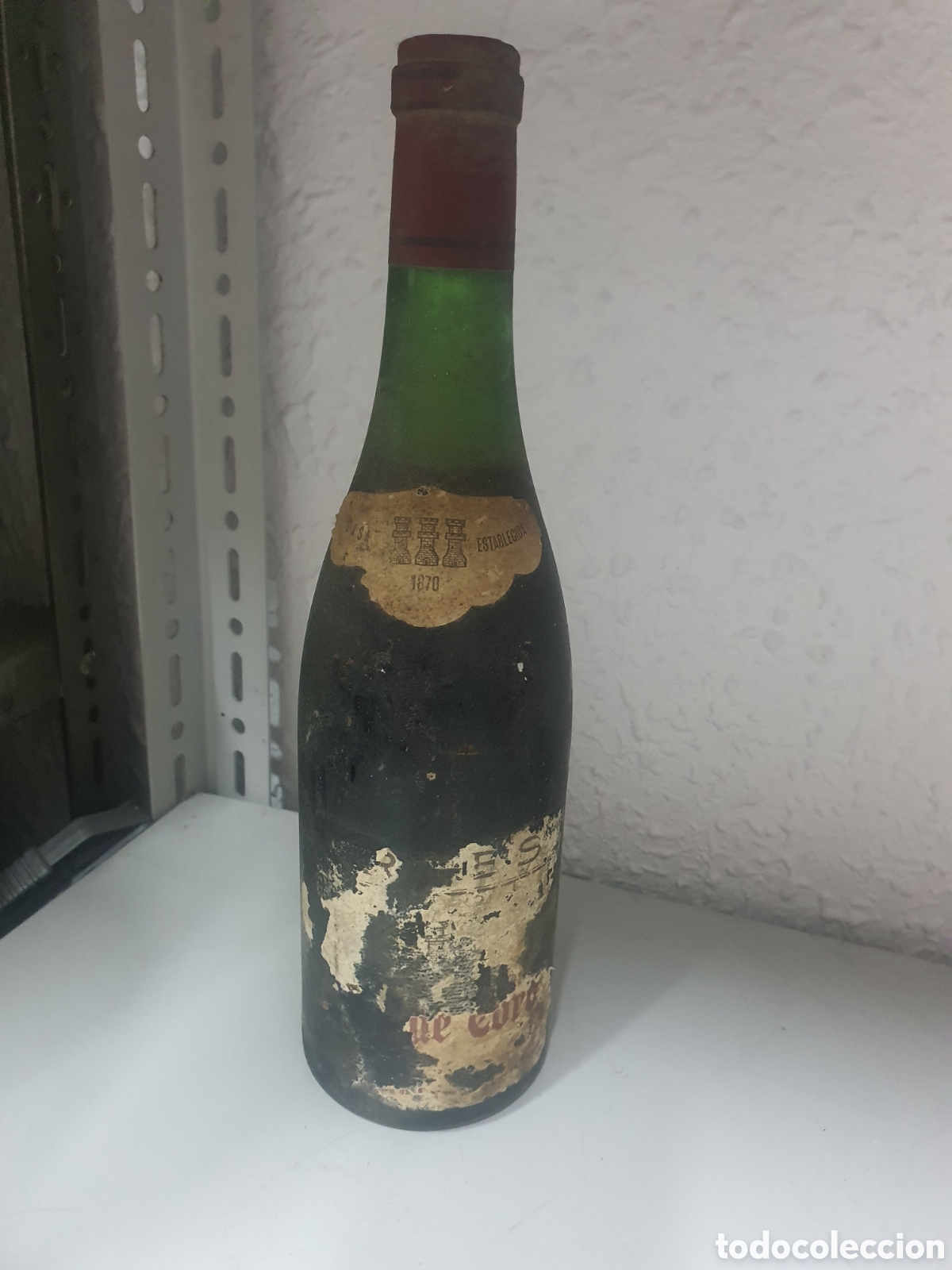 Collection of wines and liquors: Antigua botella de vino torres
