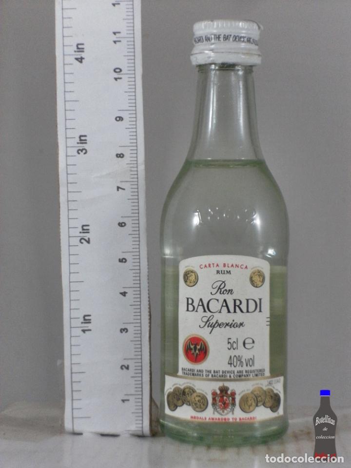 Collection of wines and liquors: BOTELLITA BOTELLIN CARTA BLANCA RON BACARDI SUPERIOR MARTINI ROSSI TORINO Y SUIZA