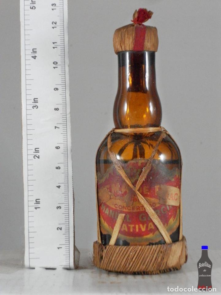 Colecionismo de vinhos e licores: BOTELLITA BOTELLIN CREMA DE RON MANUEL GARCIA JATIVA