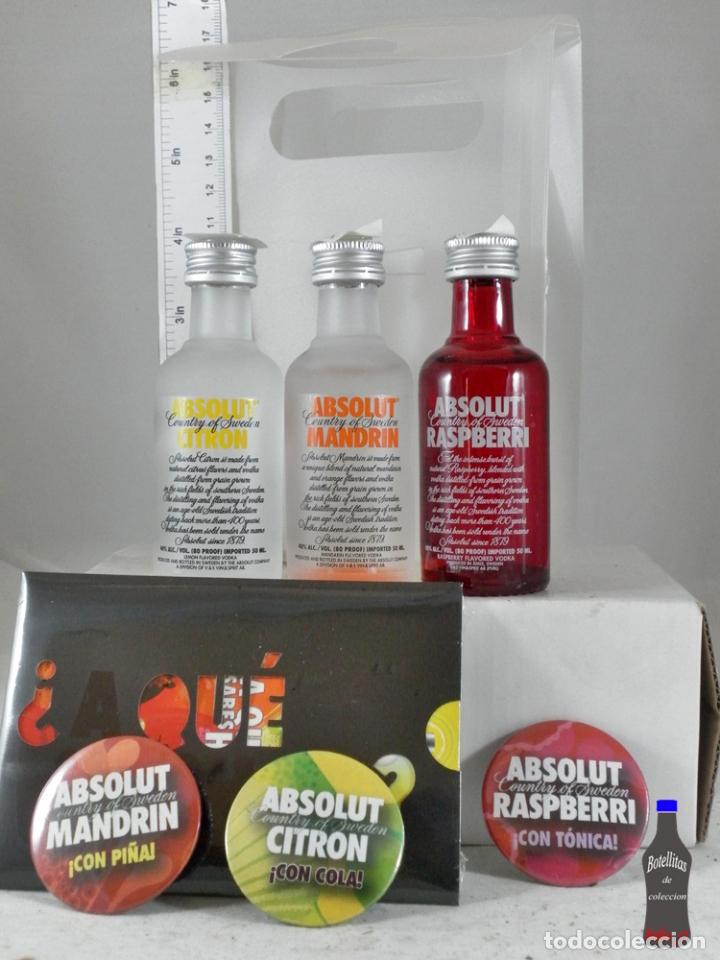 Sammlung von Weinen und Lik&ouml;ren: BOTELLITA BOTELLIN LOTE 3 ABSOLUT VODKA VIN SPIRIT SWEDEN + PUBLICIDAD CHAPAS CAJA