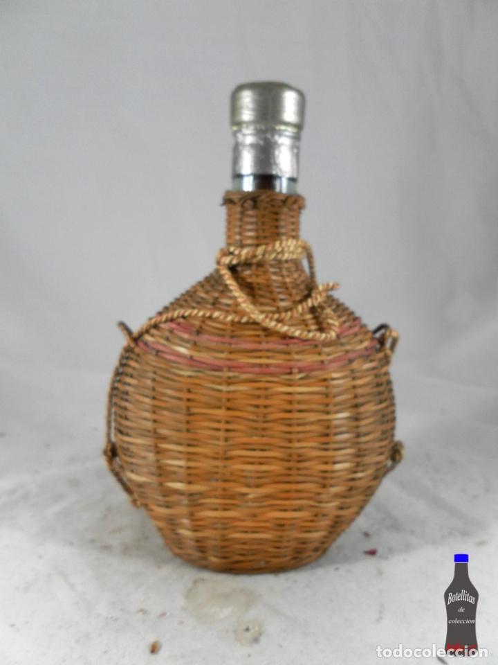 Collection of wines and liquors: BOTELLA APERITIVO PALO FRIGOLA ANTIGUA FORRADA MIMBRE VICENTE MARI MAYANS IBIZA