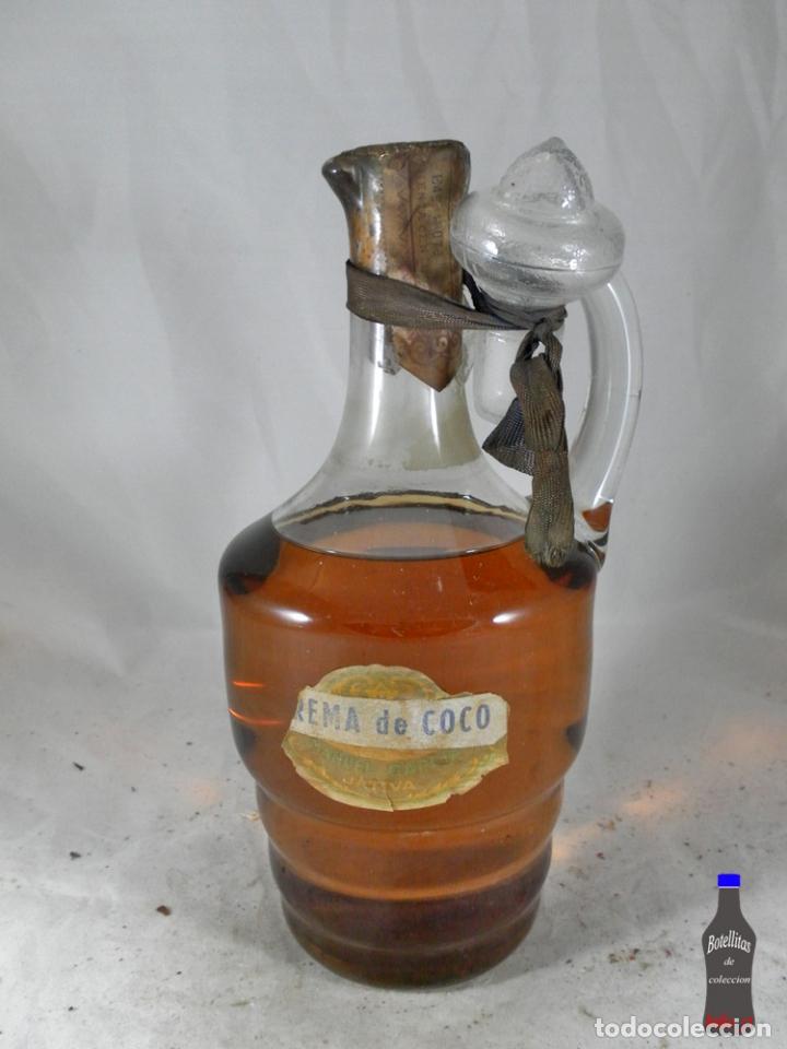 Collectionnisme de vins et liqueurs: BOTELLA JARRA CREMA DE COCO MANUEL GARCIA JATIVA 80 CENTIMOS