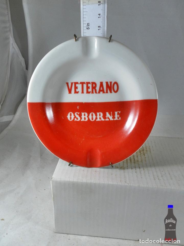 Collection of wines and liquors: CENICERO VETERANO OSBORNE ROJO MAS COLGADOR PARED