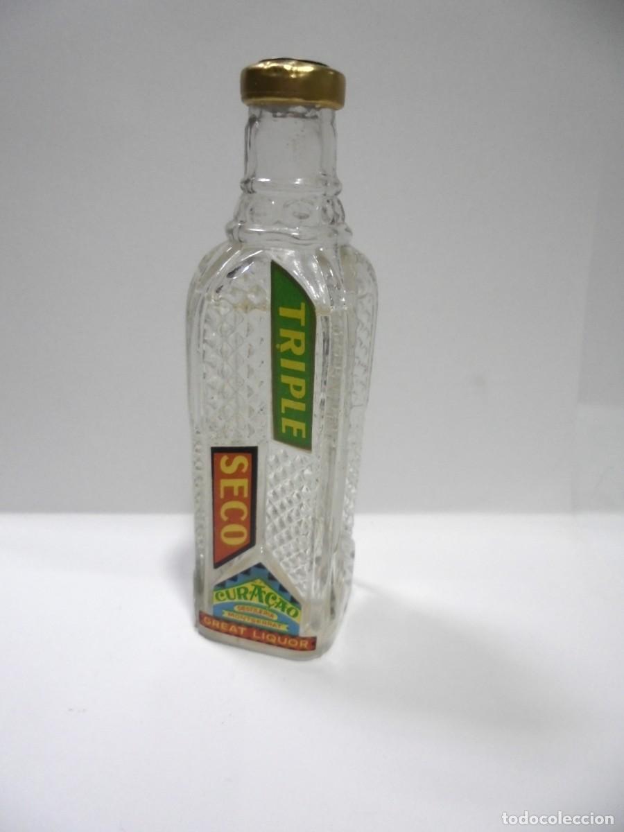 Coleccionismo de vinos y licores: BOTELLIN DE LICOR CURACAO. TRIPLE SECO. DESTILERIA MONTSERRAT. VER FOTOS.
