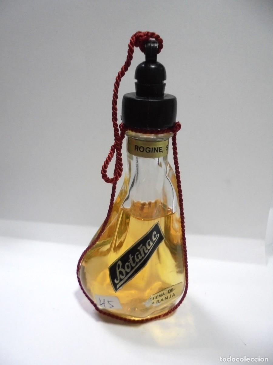 Coleccionismo de vinos y licores: BOTELLIN DE CREMA DE NARANJA. BOTA&Ntilde;AC. CERRADA. VER FOTOS.