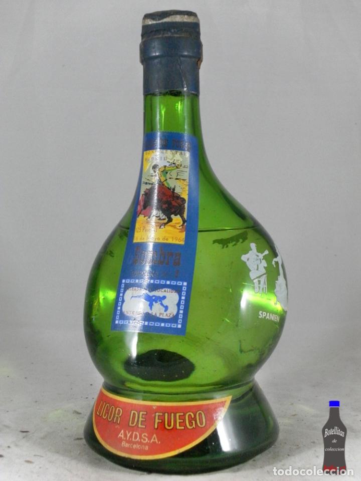 Coleccionismo de vinos y licores: BOTELLA LICOR DE FUEGO AYDSA BARCELONA PLZA TOROS MONUMENTAL PARIS 1964