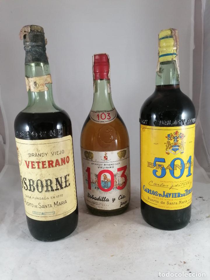 Coleccionismo de vinos y licores: LOTE 3 BOTELLAS BRANDY 103 VETERANO 501 OSBORNE TERRY BOBADILLA CORCHO 80 CENTIMOS 1 LITRO