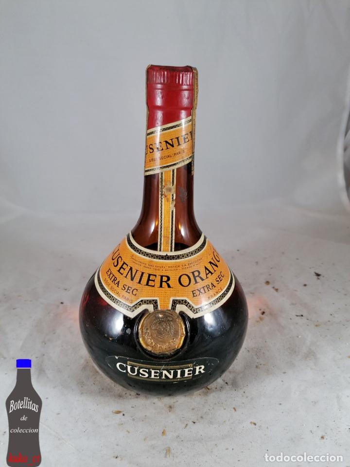 Sammlung von Weinen und Lik&ouml;ren: BOTELLA LICOR CUSENIER ORANGE EXTRA SEC ANTICH S.A. BARCELONA 1.6 PESETAS