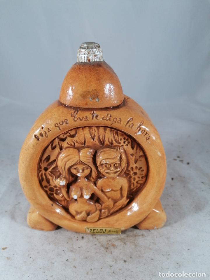 Coleccionismo de vinos y licores: BOTELLITA BOTELLIN FIGURA BRANDY CAMPENY ADAN EVA RELOJ