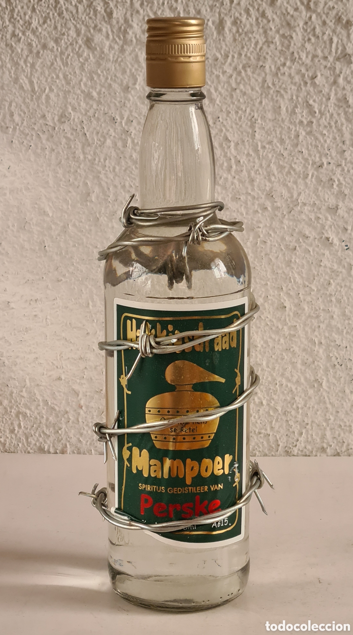 Coleccionismo de vinos y licores: Botella Cristal Alambre de Espinos Mampoer Perske Aguardiente Sud&aacute;frica - Precintada - Licor &Aacute;frica