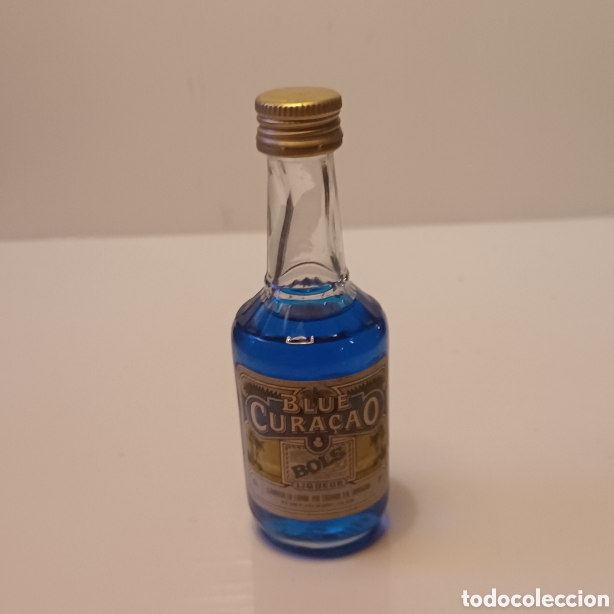 Coleccionismo de vinos y licores: Miniatura botellin cristal mini botella licor Blue Cura&ccedil;ao BOLS 11 cm altura