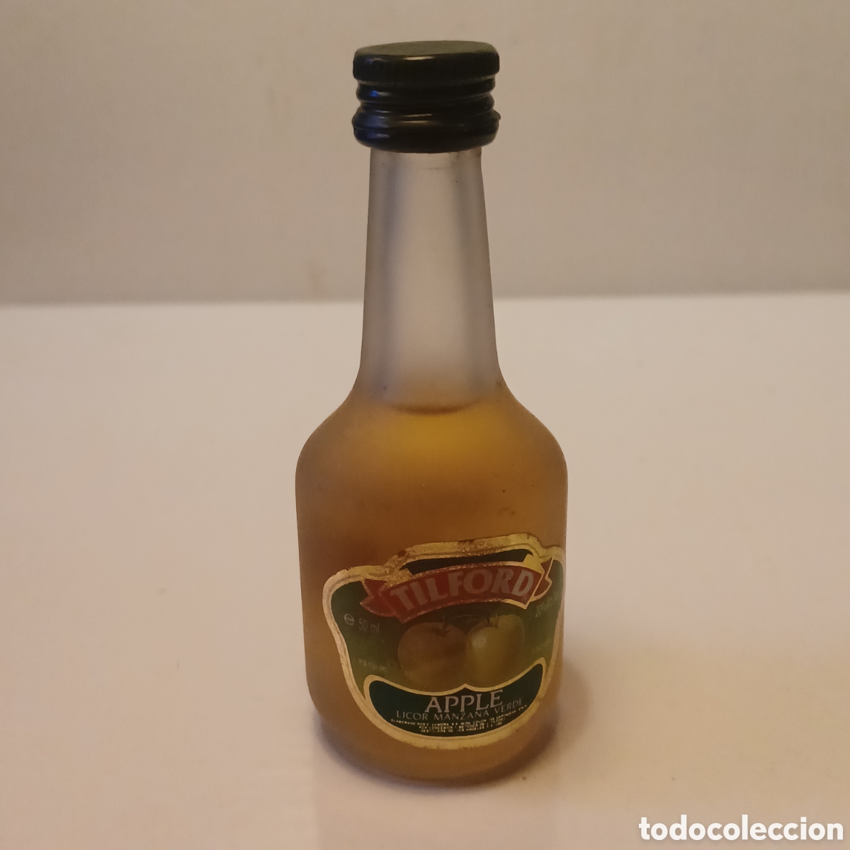 Coleccionismo de vinos y licores: Miniatura botellin cristal mini botella licor de manzana Apple Tilford 10 cm altura