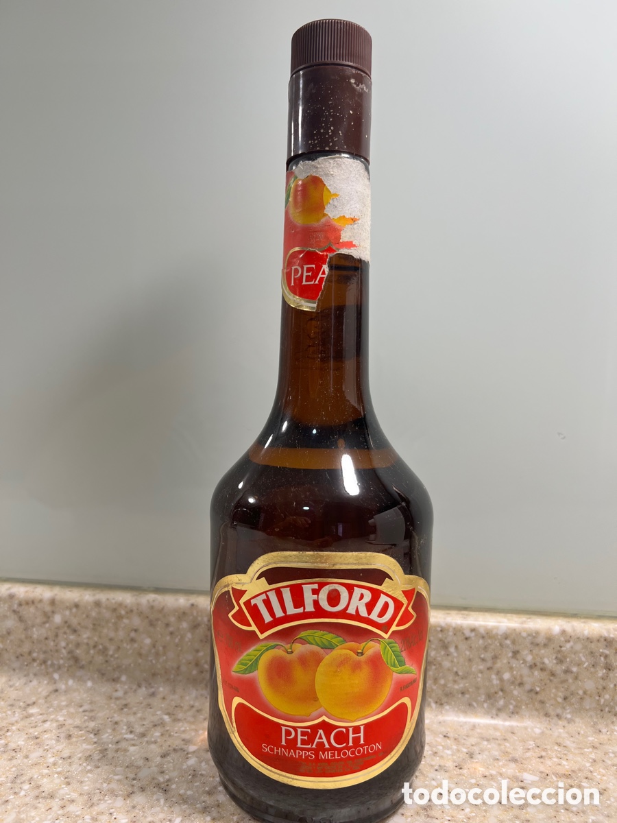 Collection of wines and liquors: Botella licor de MELOCOT&Oacute;N TILFORD nunca abierta