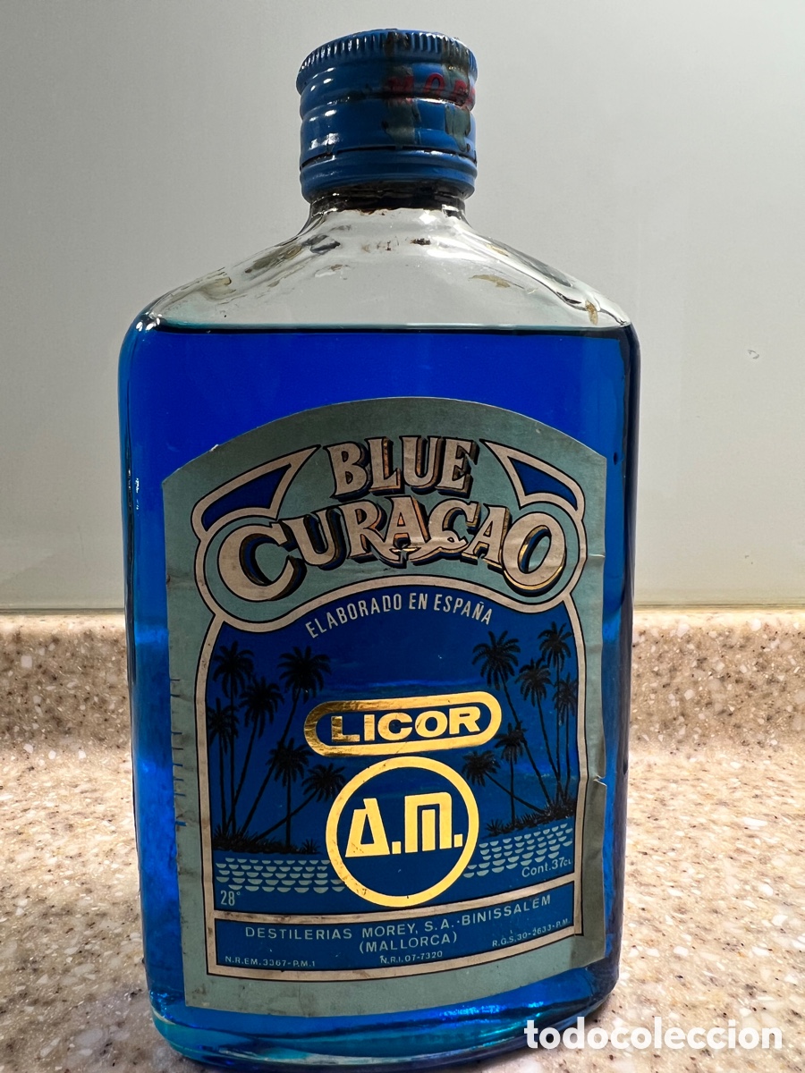 Collection of wines and liquors: Antigua petaca LICOR BLUE CURACAO / DESTILER&Iacute;AS MOREY // Binissalem MALLORCA /SIN ABRIR