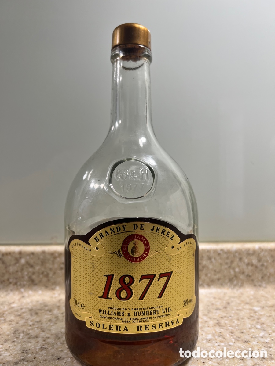 Coleccionismo de vinos y licores: Botella ABIERTA de BRANDY DE JEREZ. 1877 . SOLERA RESERVA WILLIAMS & HUMBERT . 23,5 cm de alto