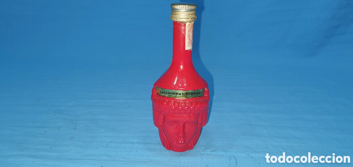 Coleccionismo de vinos y licores: BOTELLIN ROSTRO ROJO HOMBRE Y MUJER. LICOR ESTOMACAL LIBERO. SIN ABRIR