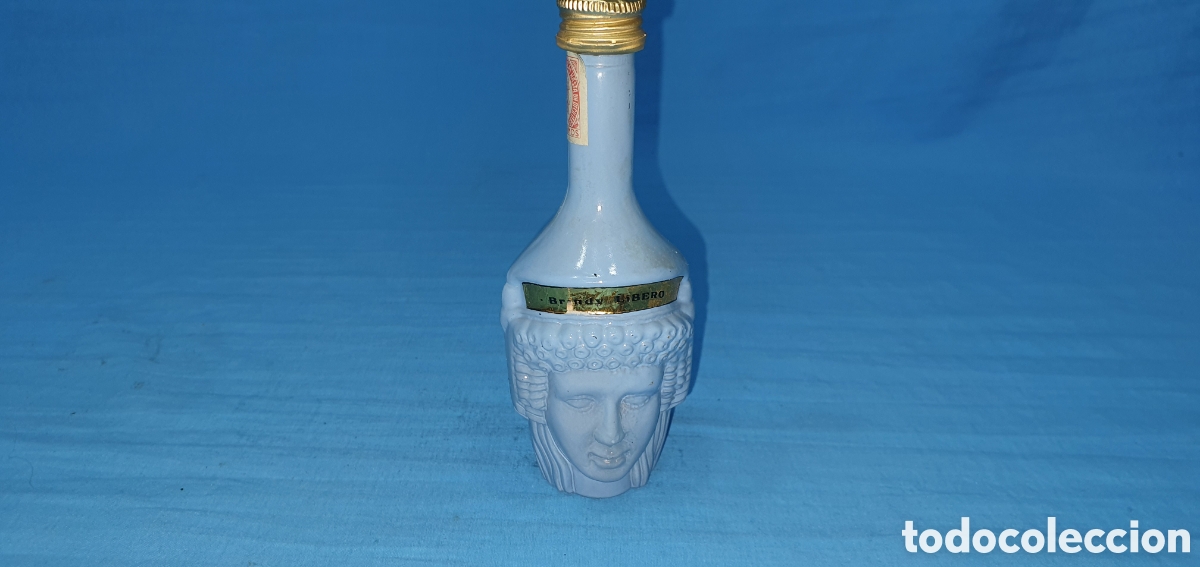 Coleccionismo de vinos y licores: BOTELLIN ROSTRO AZUL HOMBRE Y MUJER. BRANDY LIBERO. SIN ABRIR