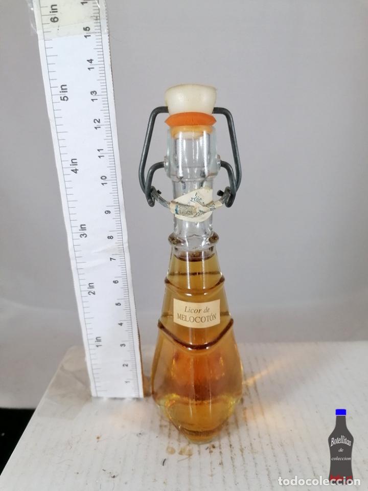Coleccionismo de vinos y licores: BOTELLITA BOTELLIN LICOR DE MELOCOTON