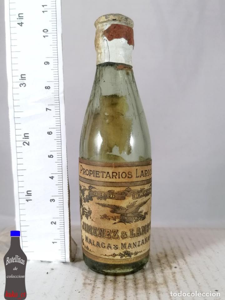 Coleccionismo de vinos y licores: BOTELLITA BOTELLIN OLD BRANDY PROPIETARIOS LARIOS JIMENEZ & LAMOTHE MALAGA Y MANZANARES