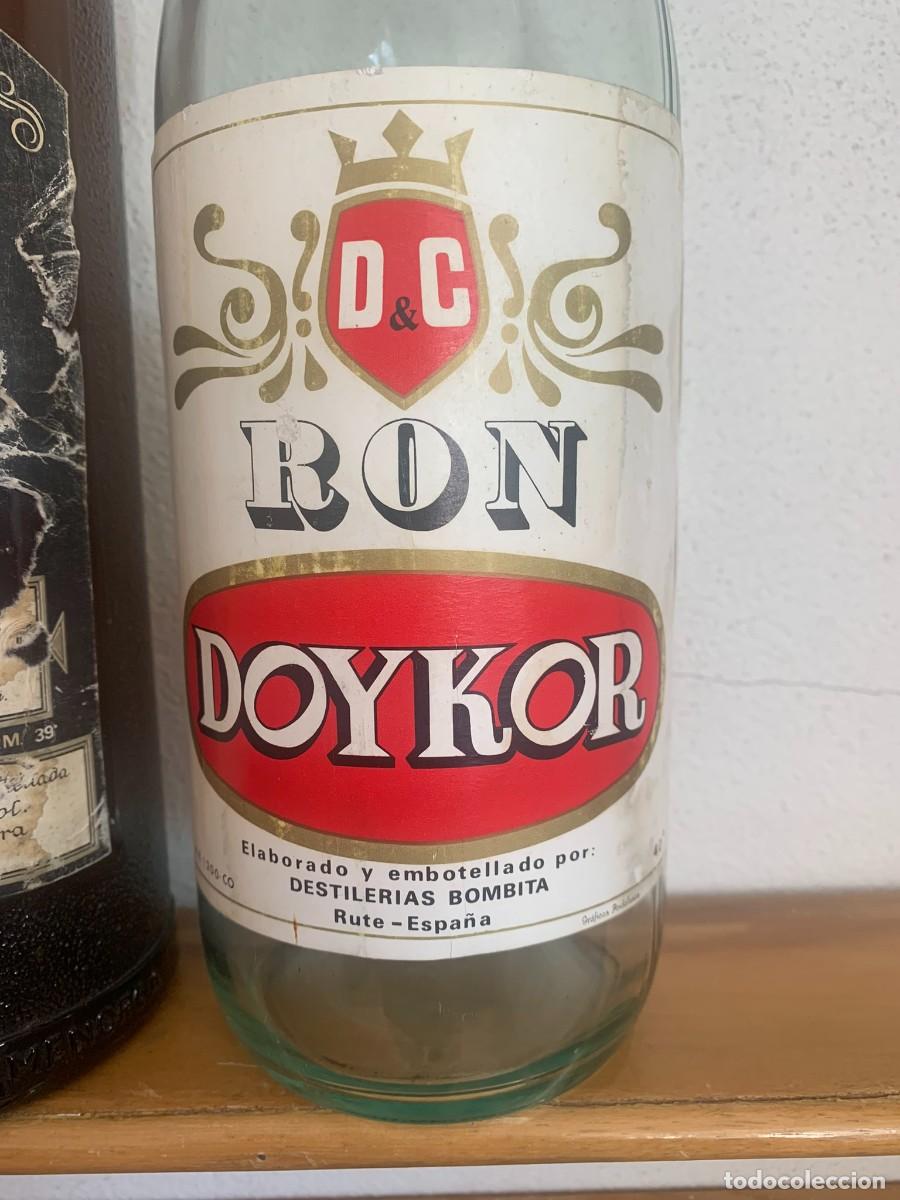 Coleccionismo de vinos y licores: BOTELLAS GIN BELTRAN MAHON Y RON DOYKOR DESTILER&Iacute;AS BOMBITA RUTE