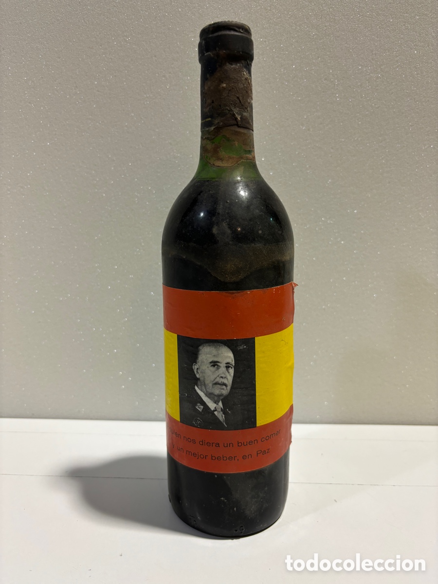 Collection of wines and liquors: Botella de vino con la cara de franco y bandera espa&ntilde;ola