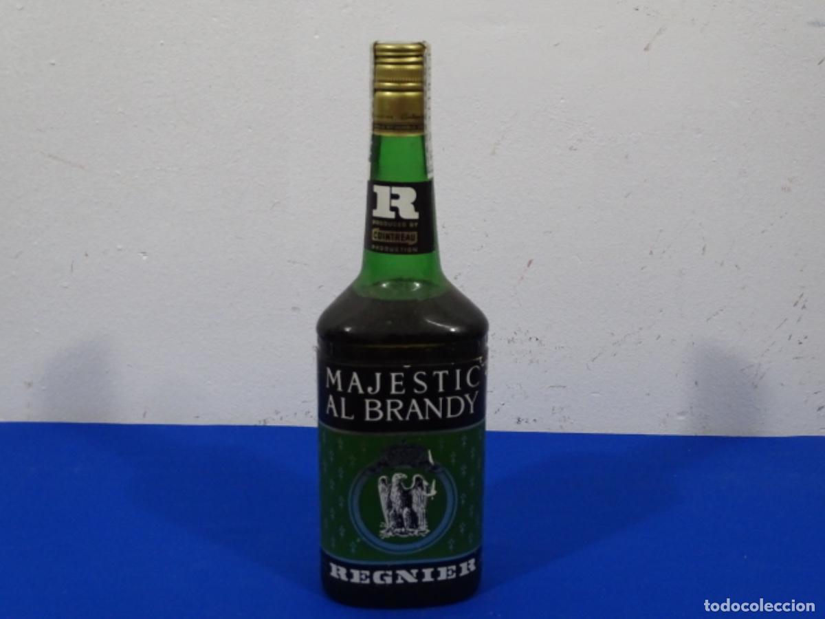 Coleccionismo de vinos y licores: BOTELLA MAJESTIC AL BRANDY REGNIER. 0.70 LITROS. 8 PESETAS FRANCO.