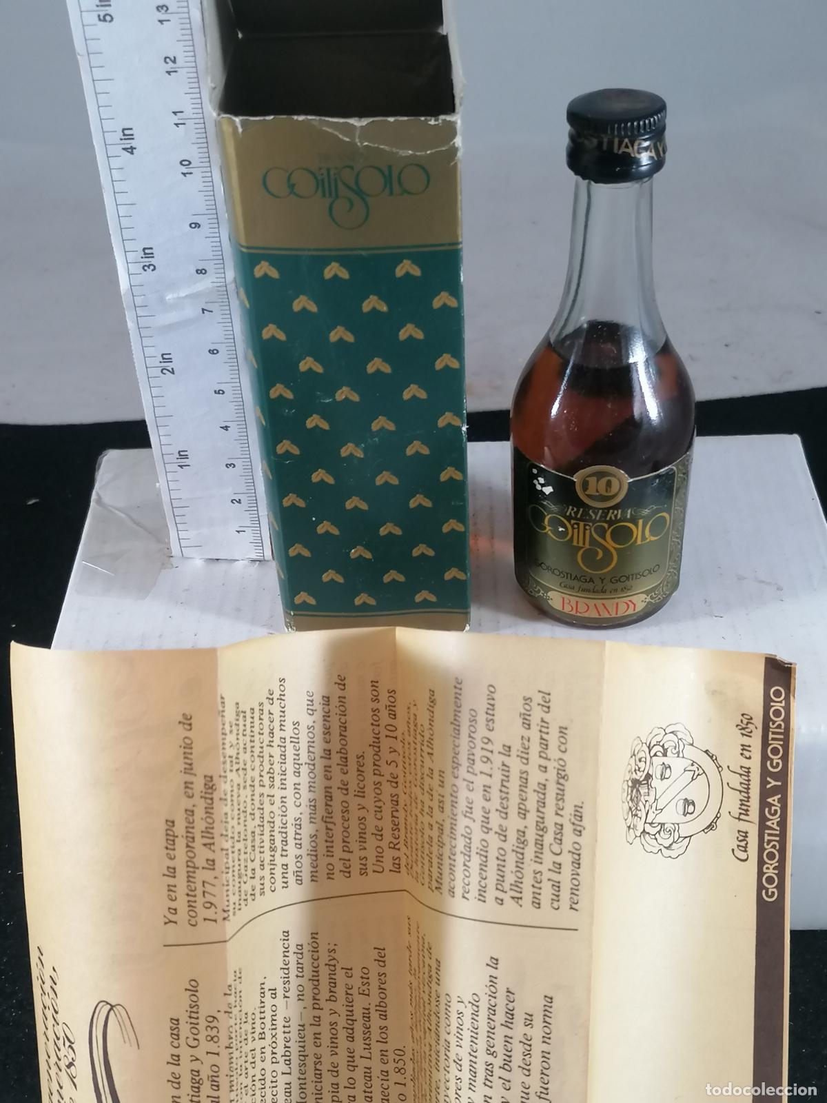 Coleccionismo de vinos y licores: BOTELLITA BOTELLIN BRANDY REVERVA 10 A&Ntilde;OS GOITISOLO GOROSTIAGA CON CAJA Y TRIPTICO