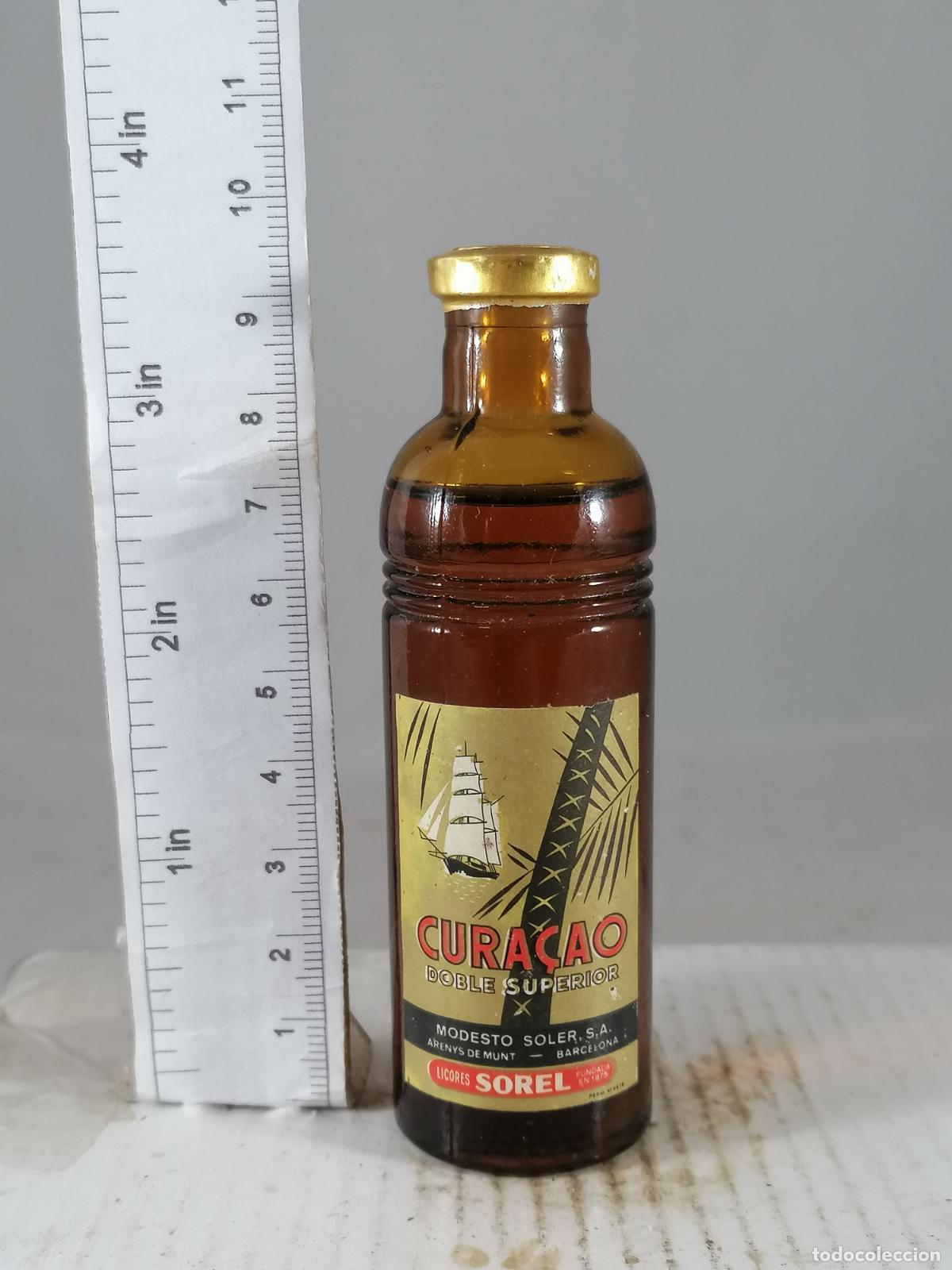 Coleccionismo de vinos y licores: BOTELLITA BOTELLIN CURACAO DOBLE MODESTO SOLER LICORES SOREL ARENYS DE MUNT