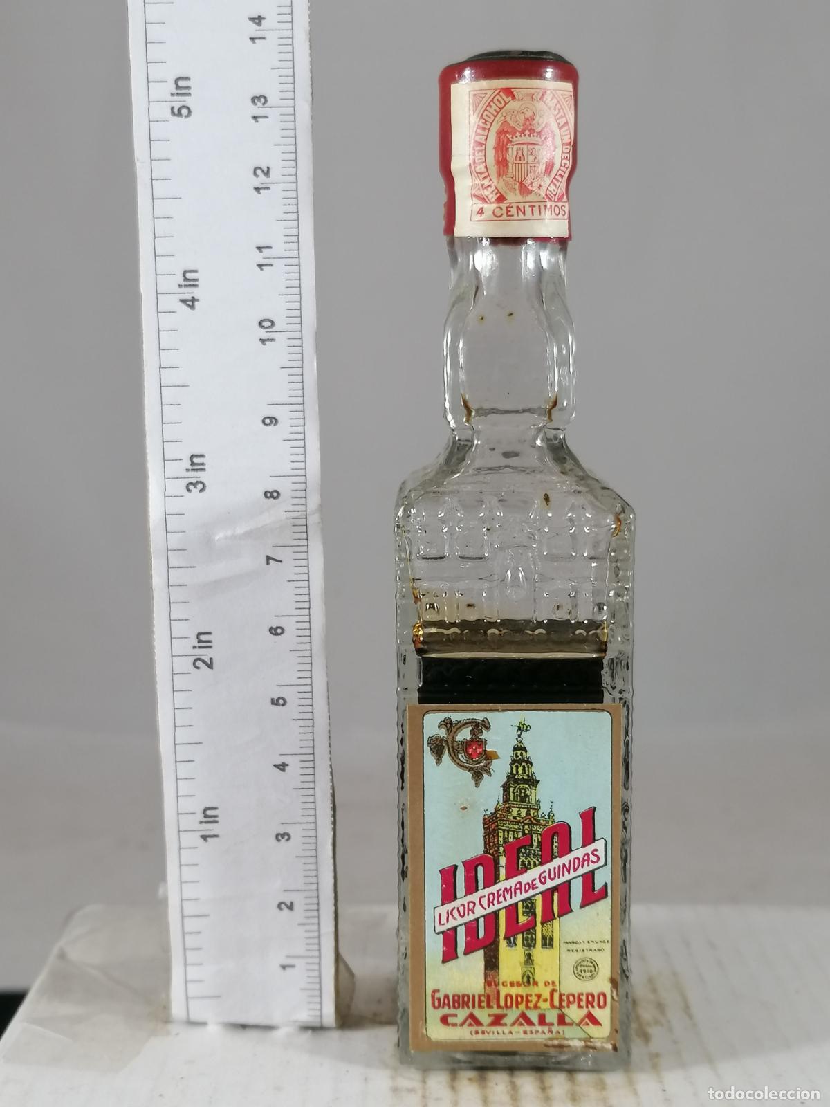 Coleccionismo de vinos y licores: BOTELLITA BOTELLIN LICOR DE GUINDAS IDEAL GABRIEL LOPEZ CEPERO CAZALLA DE LA SIERRA