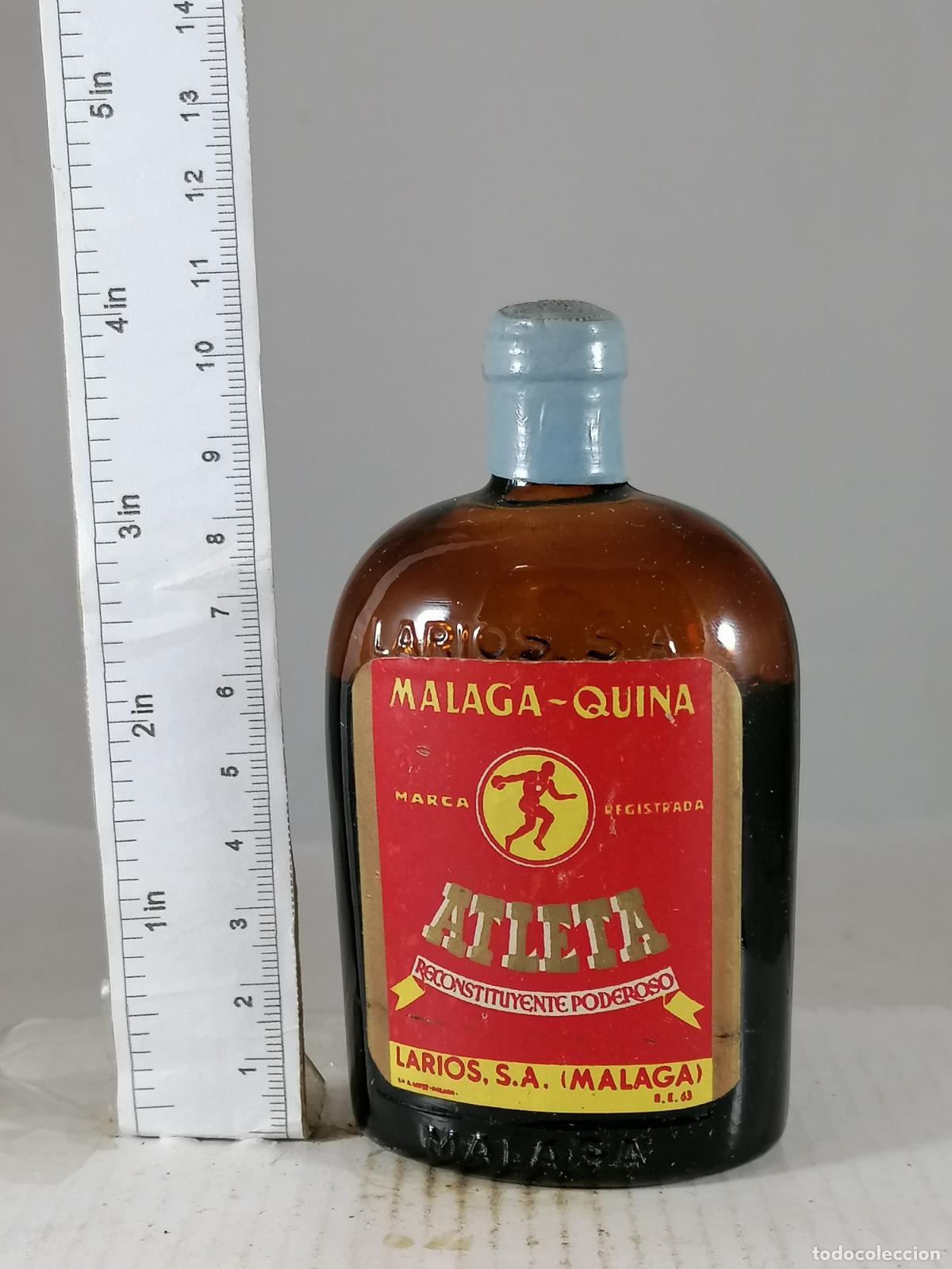 Coleccionismo de vinos y licores: BOTELLITA BOTELLIN MALAGA QUINA ATLETA LARIOS S.A. MALAGA