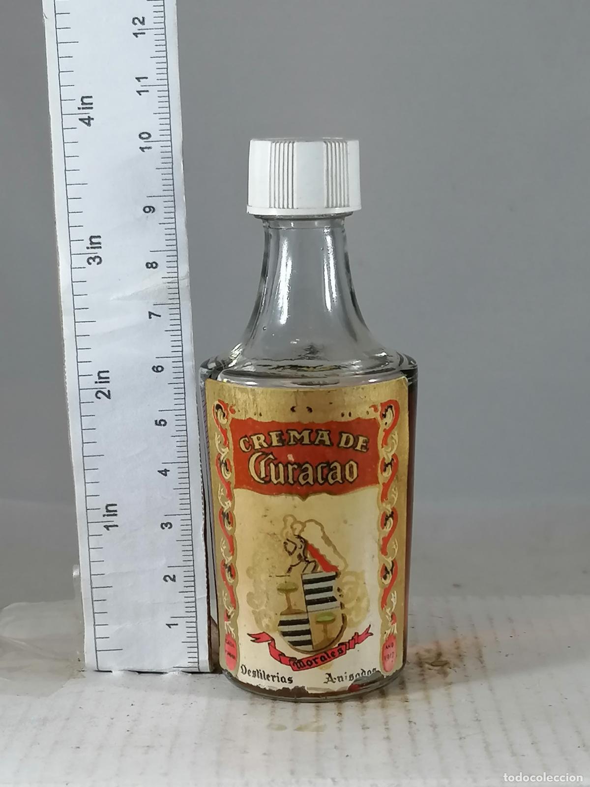 Collection of wines and liquors: BOTELLITA BOTELLIN CREMA DE CURACAO DESTILERIAS MORALES JAEN