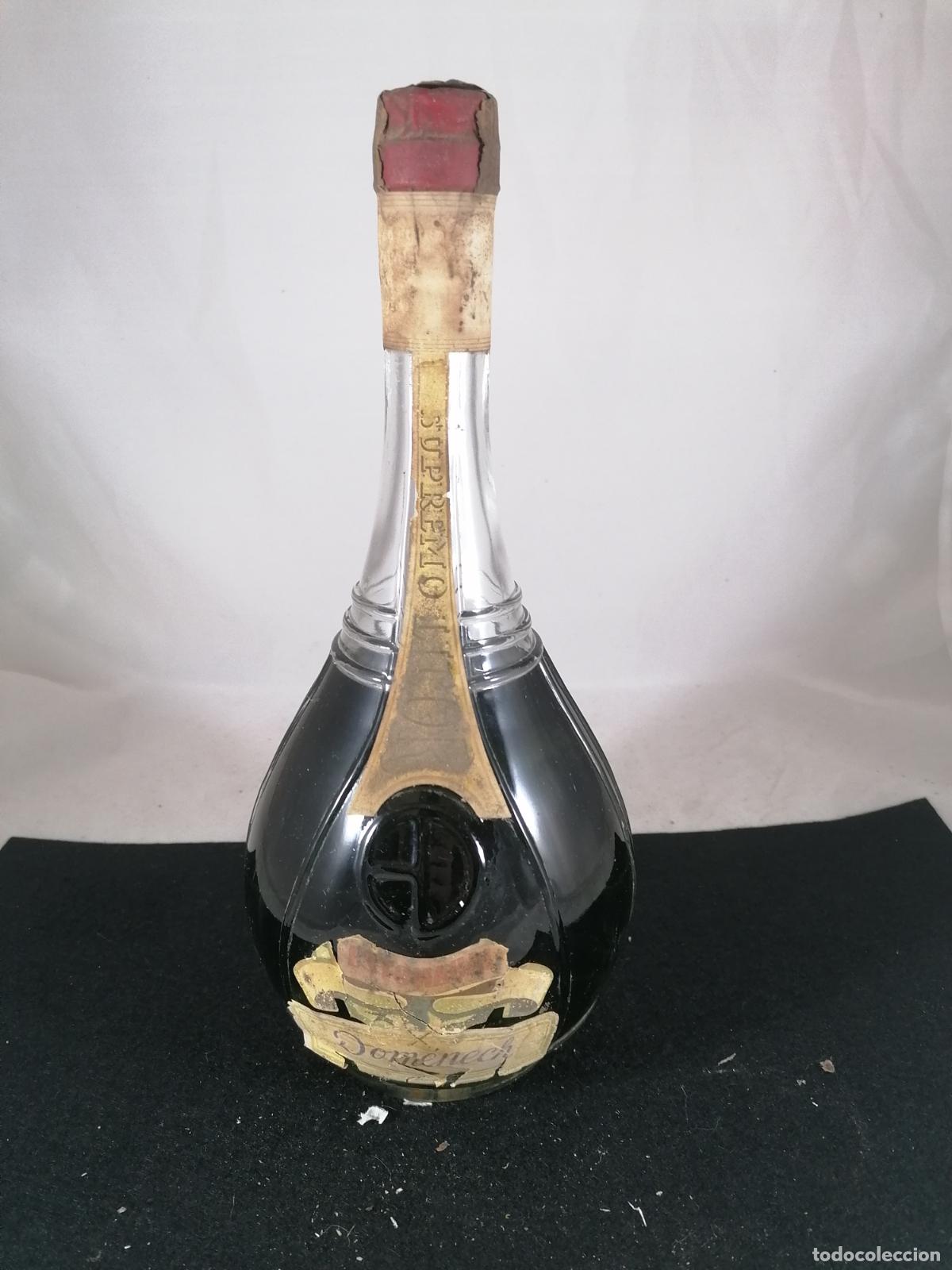 Sammlung von Weinen und Lik&ouml;ren: BOTELLA LICOR SUPREMO ESTOMACAL DOMENECH BENICARLO 1 L 80 CENTIMOS