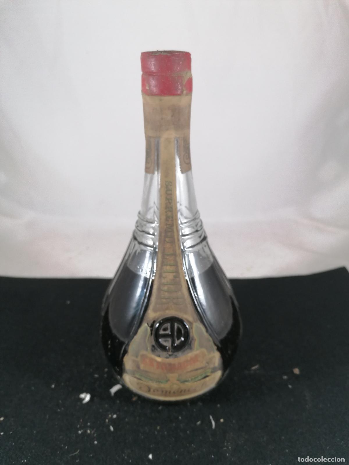 Collection of wines and liquors: BOTELLA LICOR SUPREMO ESTOMACAL DOMENECH BENICARLO 0.5 L 40 CENTIMOS