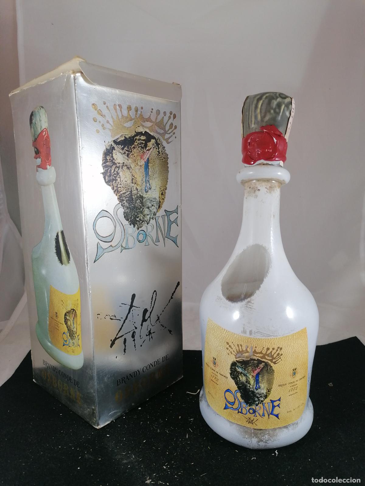 Collection of wines and liquors: BOTELLA + CAJA BRANDY CONDE DE OSBORNE PUERTO DE SANTA MARIA EDICION FIRMA DALI 4 PESETAS