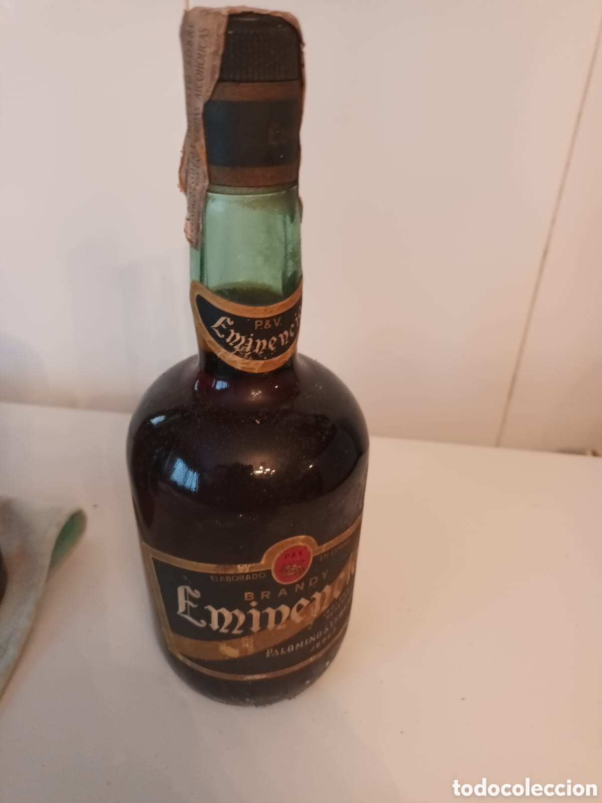Coleccionismo de vinos y licores: ANTIGUA BOTELLA BRANDY EMINENCIA A&Ntilde;OS 60