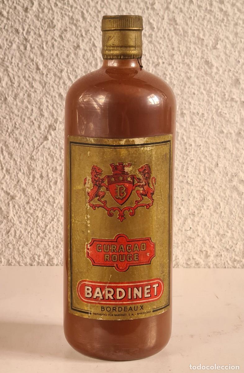 Sammlung von Weinen und Lik&ouml;ren: Botella de Cer&aacute;mica Cura&ccedil;ao Rouge Bordeaux Bardinet - Licor - Precintada