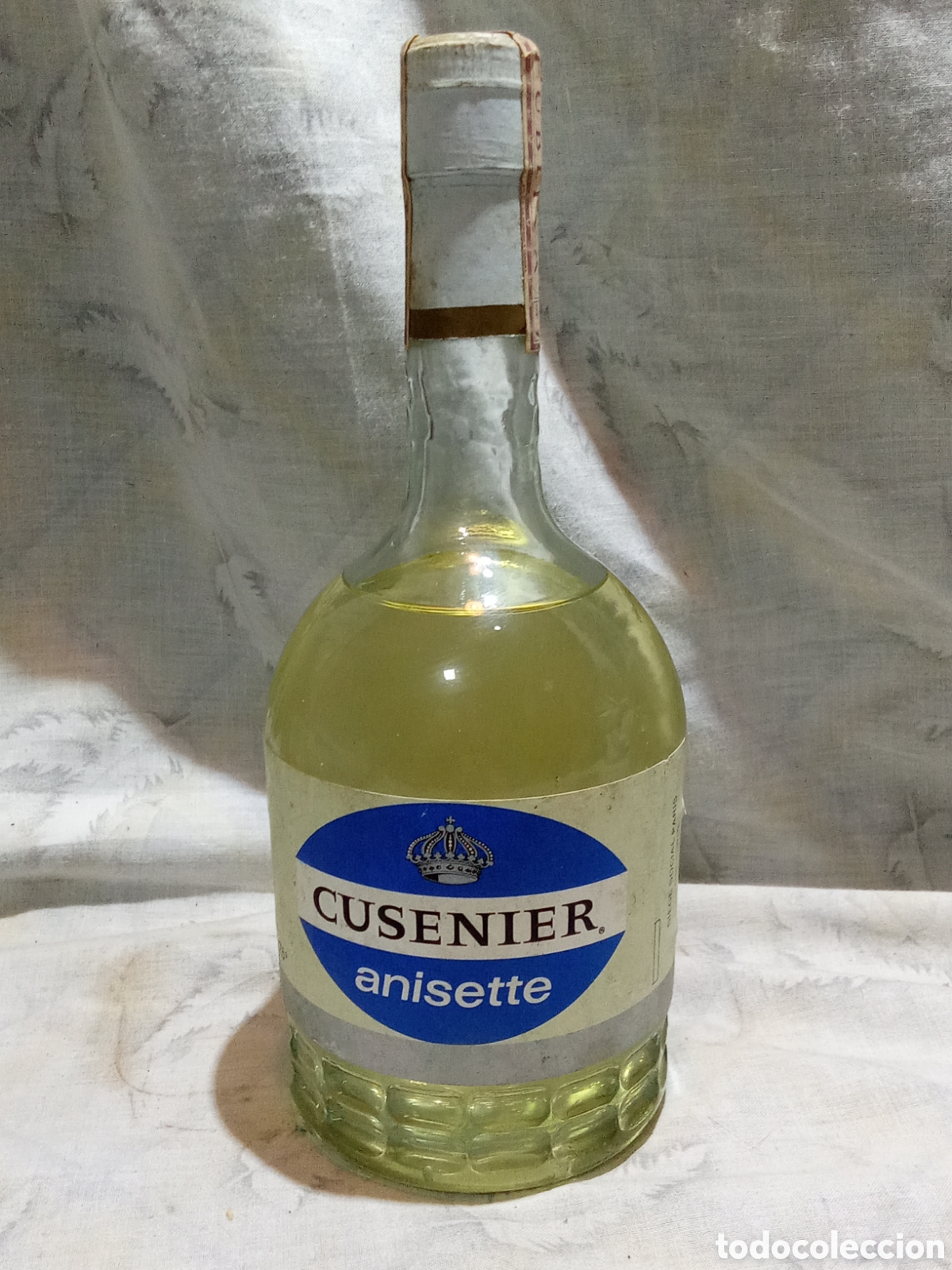 Sammlung von Weinen und Lik&ouml;ren: ANTIGUA BOTELLA ANISETTE CUSENIER CON PRECINTO