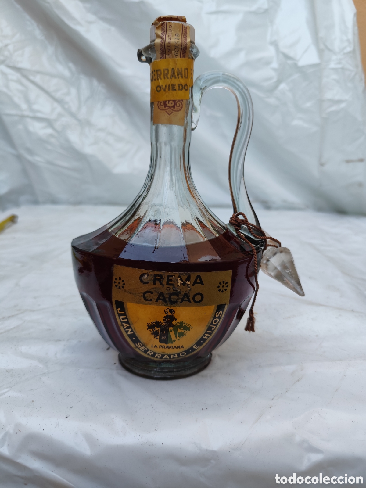 Coleccionismo de vinos y licores: Antigua botella Crema de Cacao Juan Serrano e Hijos (La Pravian Oviedo) &ndash; Precinto Hacienda &eacute;poca fr