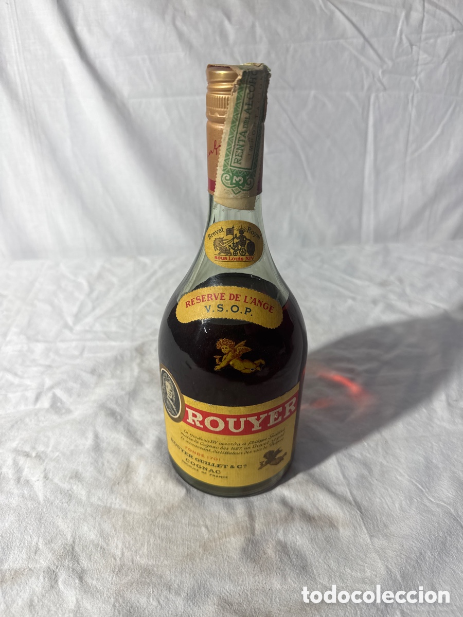 Coleccionismo de vinos y licores: Botella de co&ntilde;ac rouyer precinto de importaci&oacute;n a&ntilde;os 50