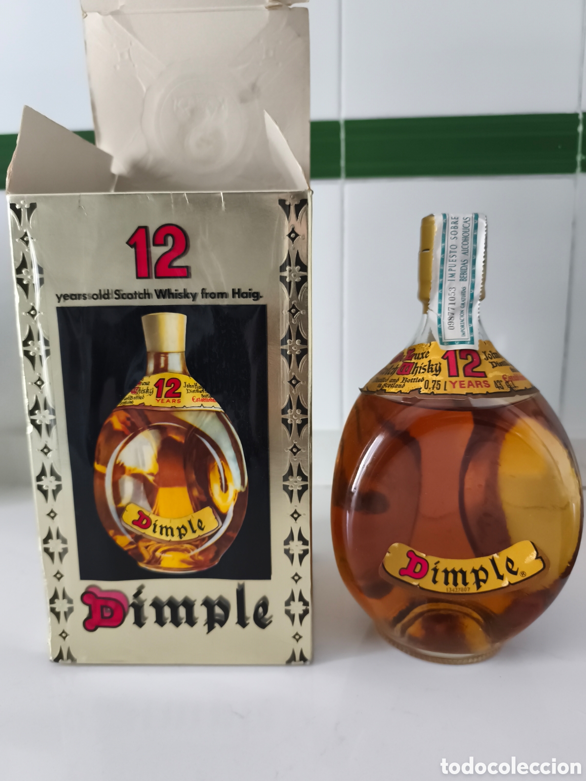 Coleccionismo de vinos y licores: Antigua botella de Whisky Dimple 12 a&ntilde;os, cerrada sello de franco