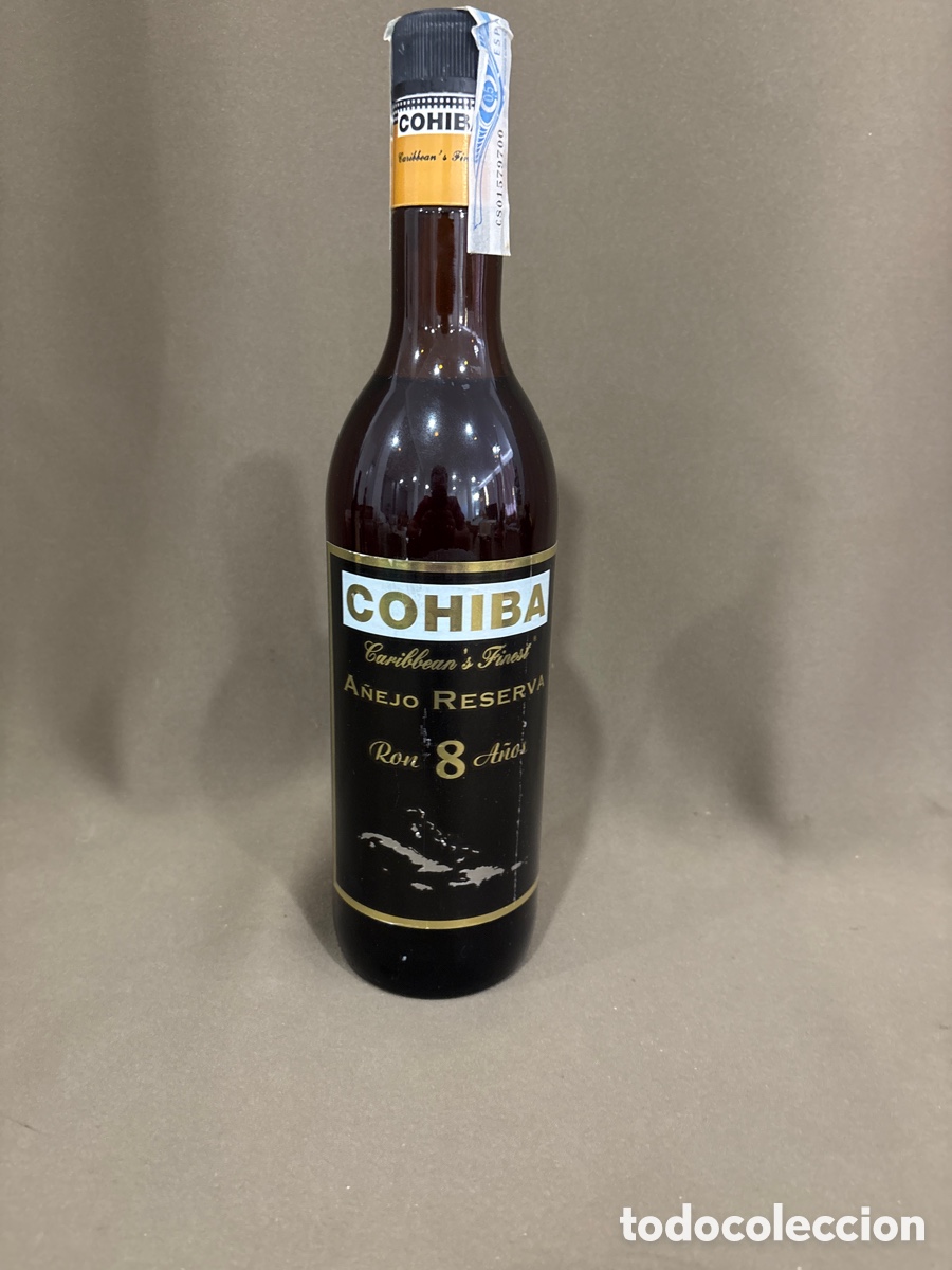 Coleccionismo de vinos y licores: Antigua botella de ron COHIBA,a&ntilde;ejo gran reserva 8 a&ntilde;os*ver fotos*