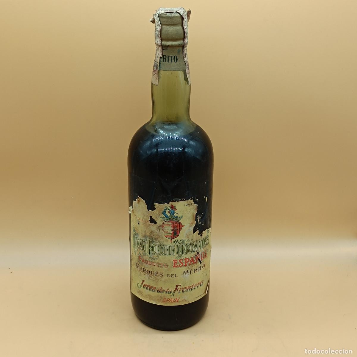 Coleccionismo de vinos y licores: BOTELLA GRAN PONCHE CERVANTES. MARQUES DE MERITO. JEREZ DE LA FRONTERA. 1L. PRECINTADA 80 CENTIMOS.