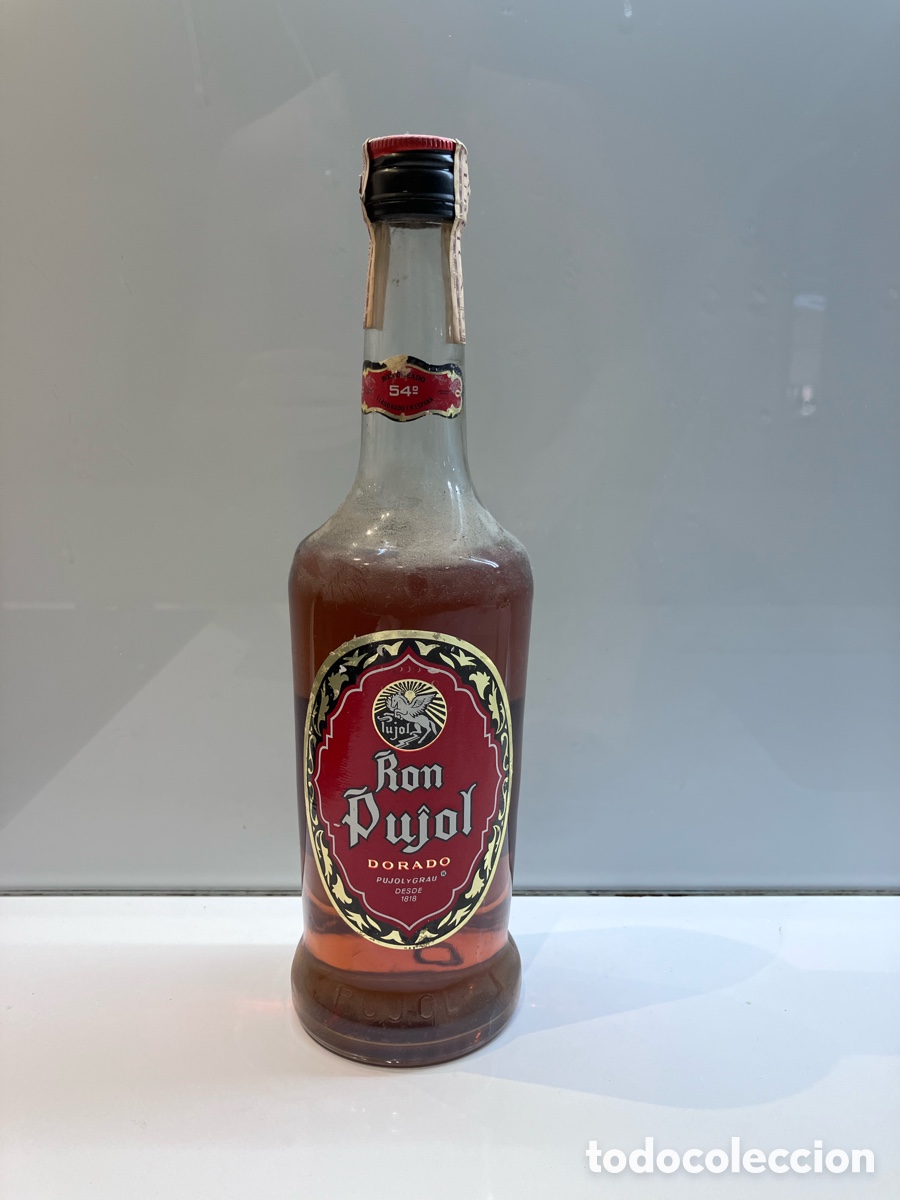Coleccionismo de vinos y licores: Ron pujol 54 grados dorado